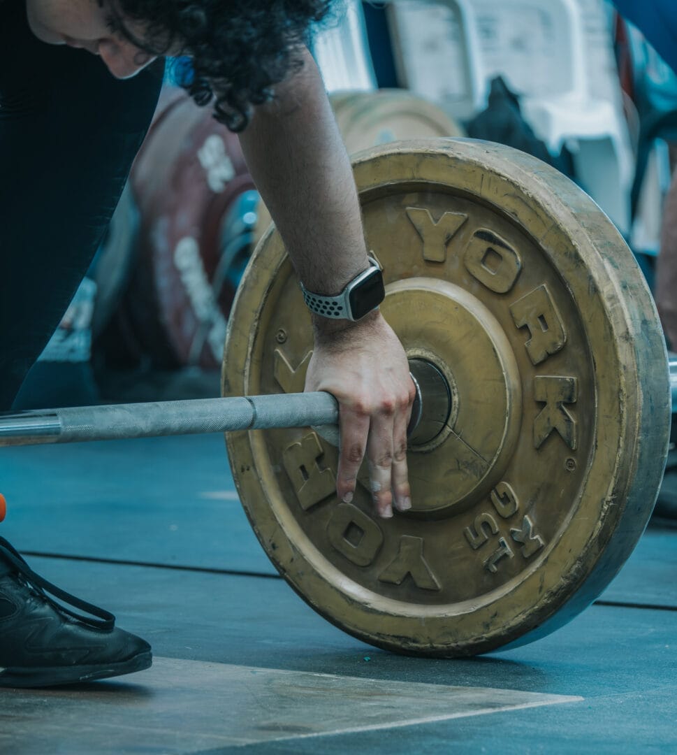 Drop-in weightlifter preparing to perform a snatch at 646.